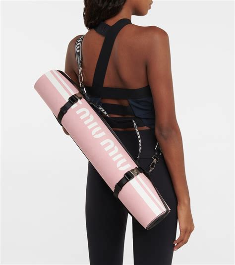 miu miu yoga mat|Logo yoga mat in pink .